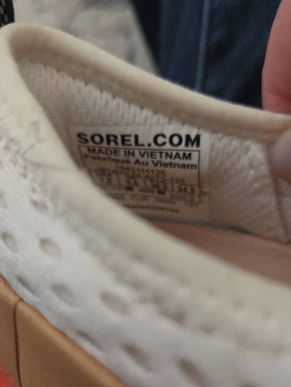 Sorel Slip-On Sneakers in White and Tan with Black Logo